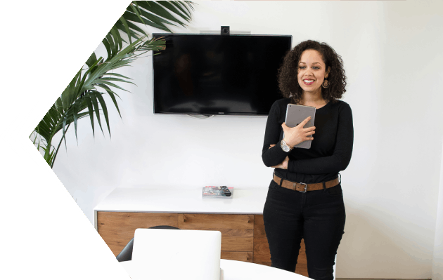 Smiling woman holding a tablet